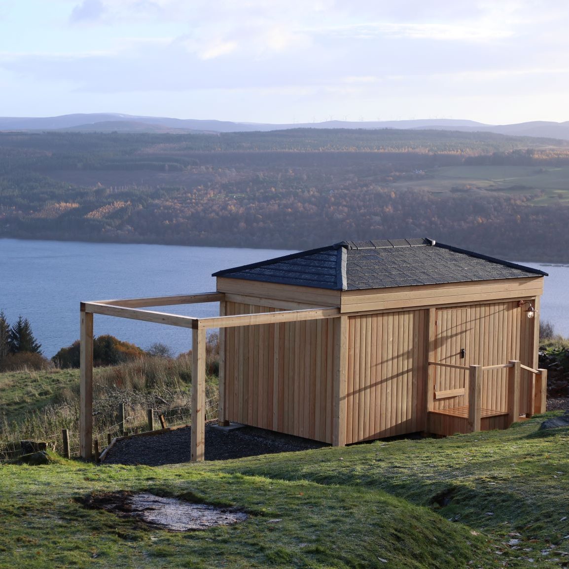 Roof fitted with Envirotile roof tiles overlooking a scenic sea background, showcasing the tile’s durability and aesthetic appeal Roof fitted with Envirotile roof tiles overlooking a scenic sea background, showcasing the tile’s durability and aesthetic appeal